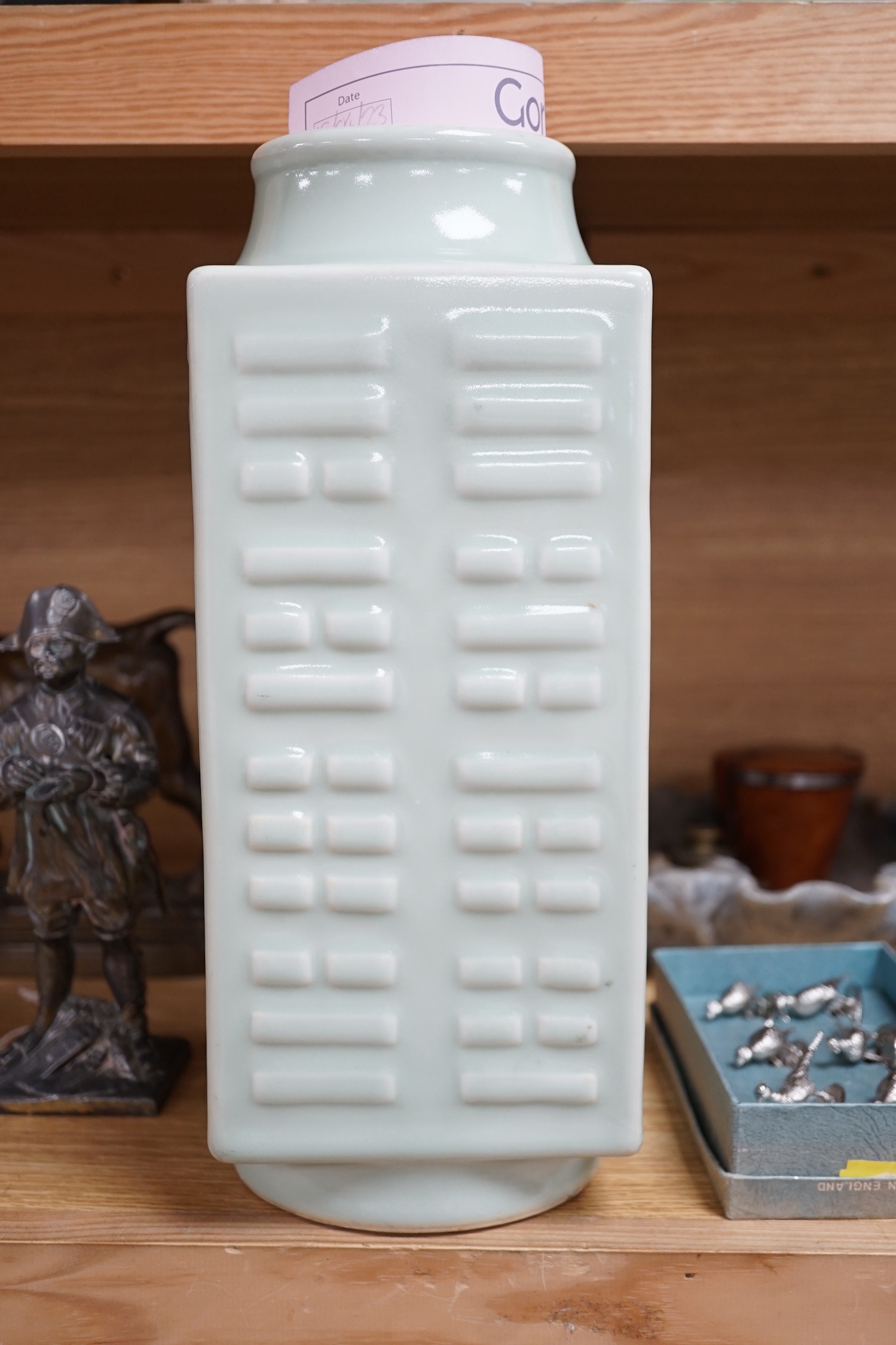 A square Chinese celadon-glazed 'cong' style vase, 30cm tall